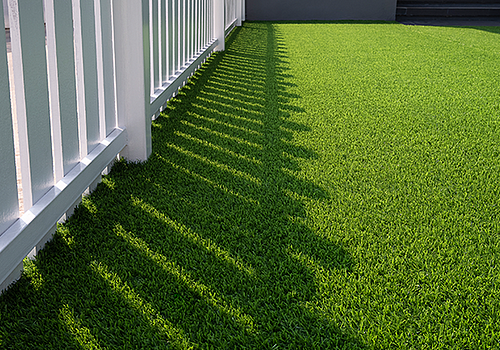 Clean lines from fence installation by Arco Outdoors create privacy in South Florida yards.